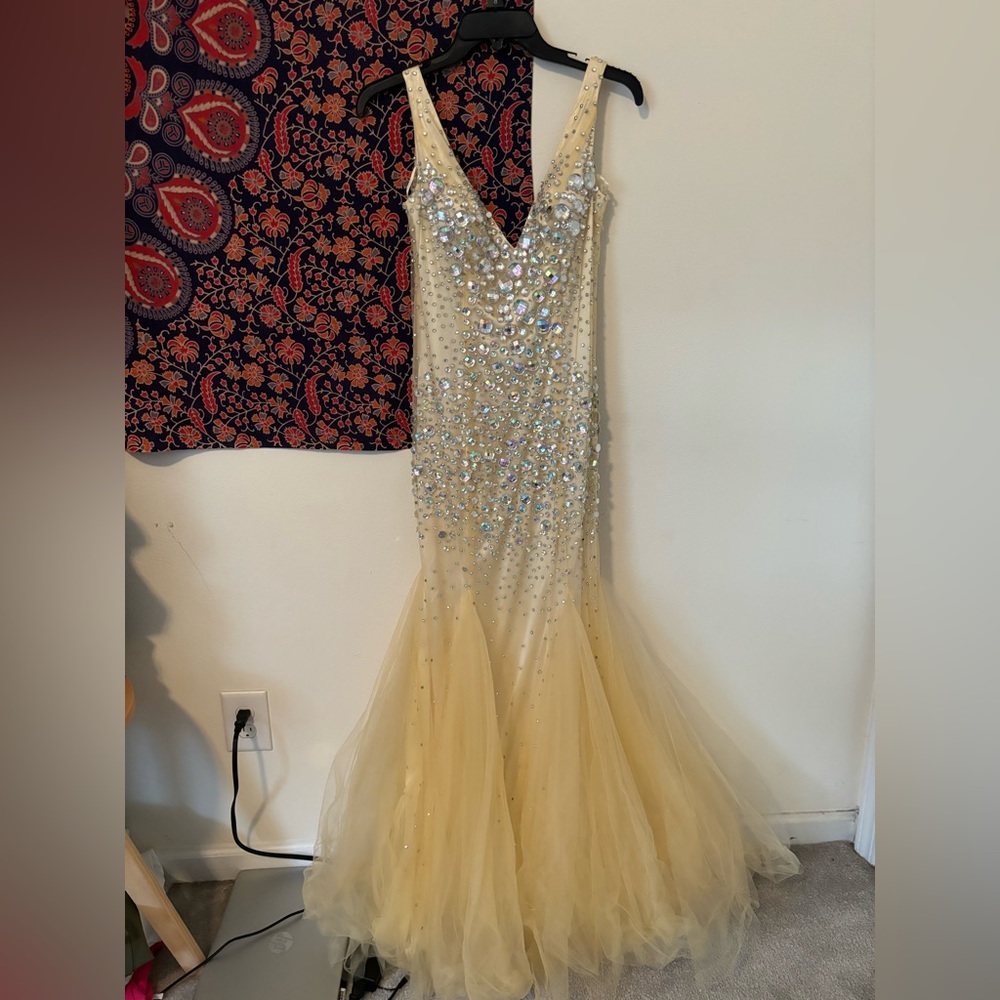Dave and Johnny Prom Dress size 7/8 and is missing a few beads along the dress.